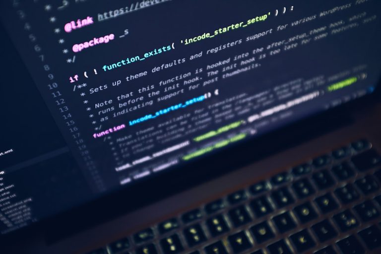 Laptop screen showing code, representing a data breach